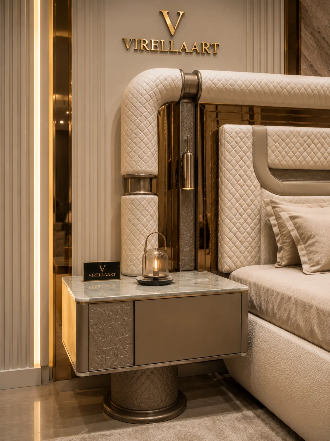 Close-up of the Aspendos bedside table with a marble-look top, textured taupe panel and the quilted cream headboard behind