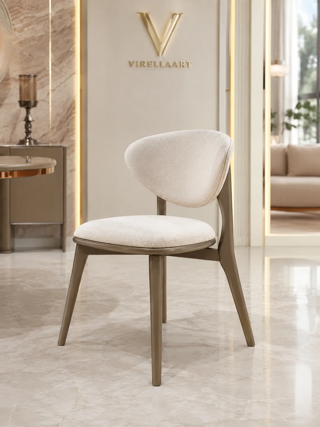 Aspendos ivory dining chair with a curved upholstered back, rounded seat and slender taupe frame