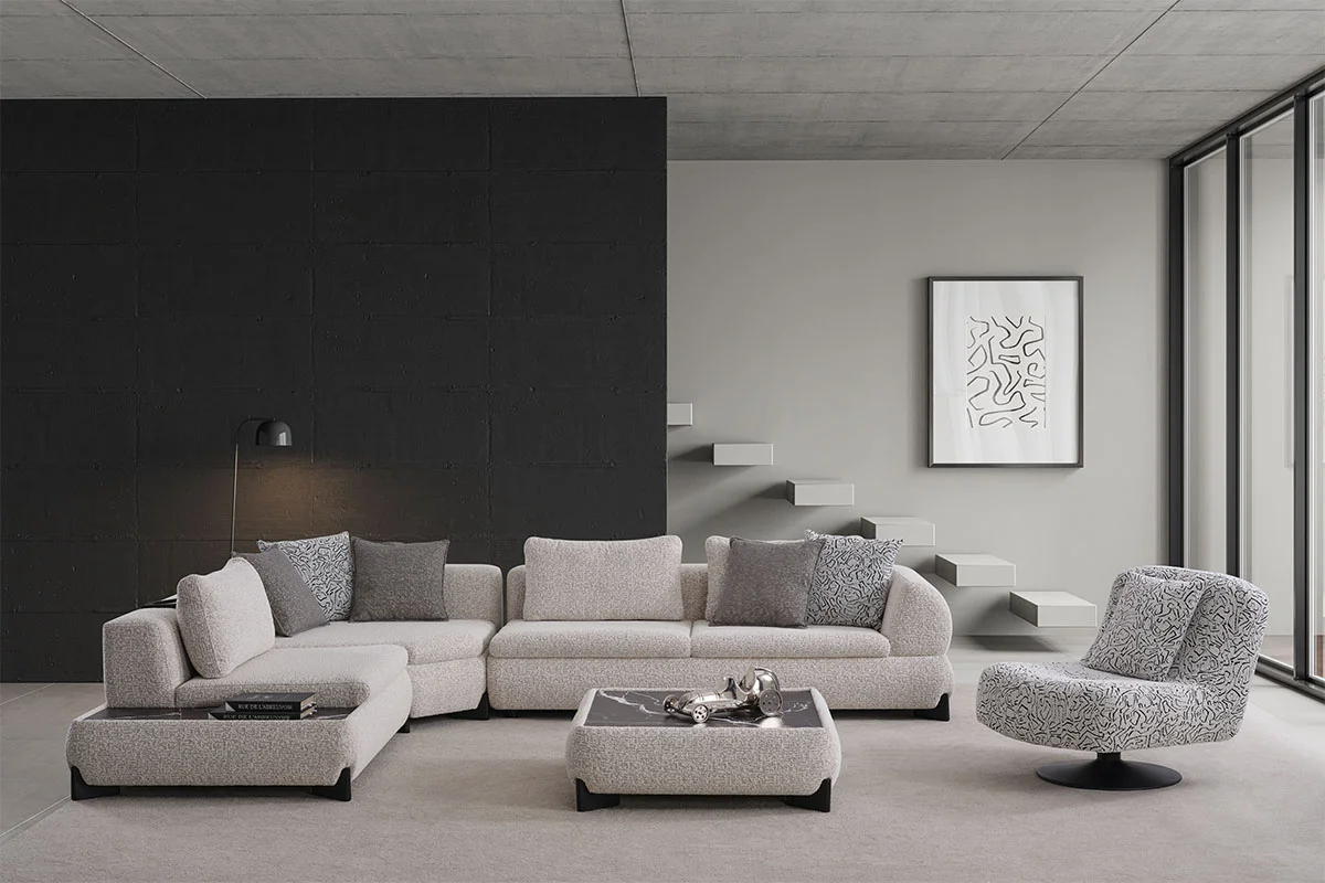 Front perspective of the Aura modular corner sofa with neutral textured upholstery and layered scatter cushions