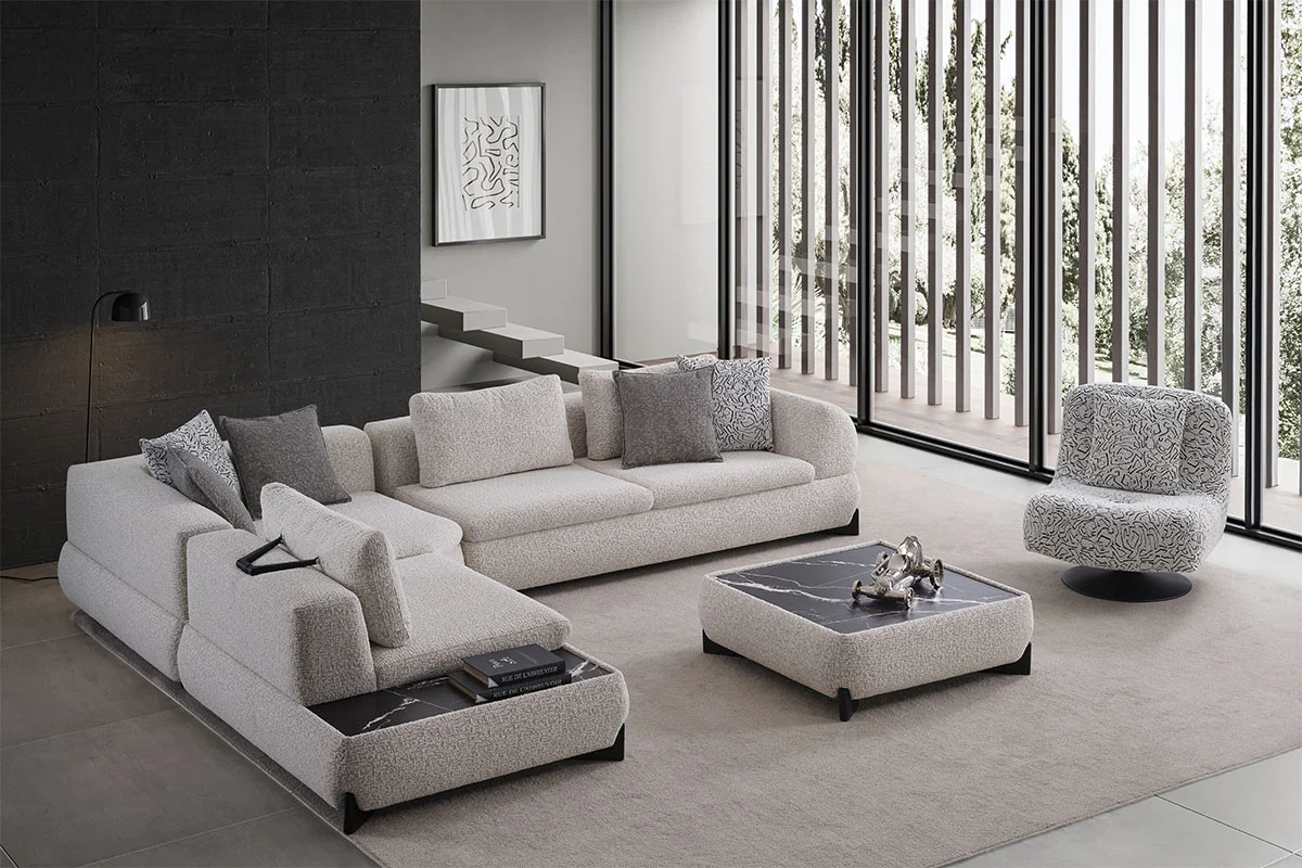 Aura modern living room set featuring a large white corner sofa, statement armchair and marble-look center table