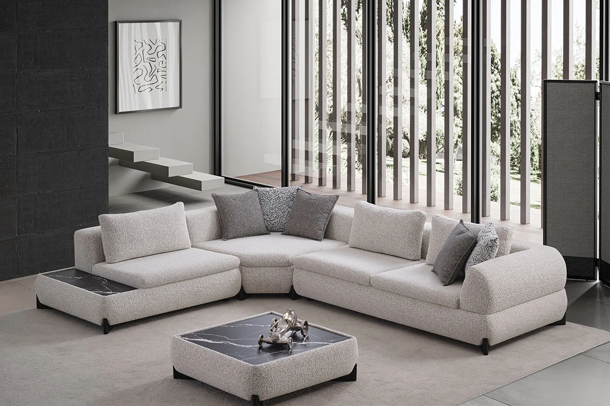 Side perspective of the Aura corner sofa highlighting its generous proportions and softly rounded modular form