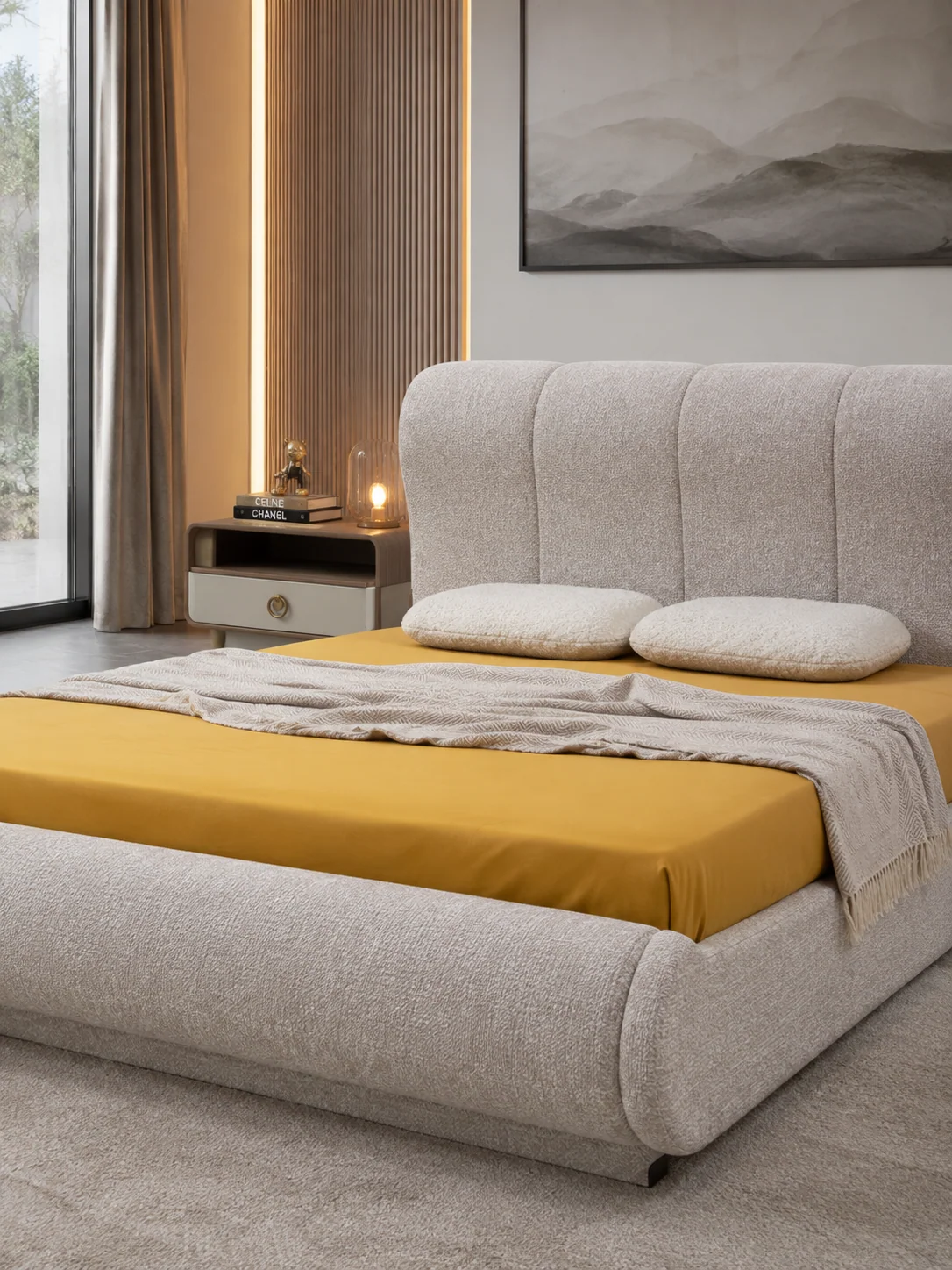 AVELLA storage bed detail with upholstered headboard, layered bedding and warm accent bench