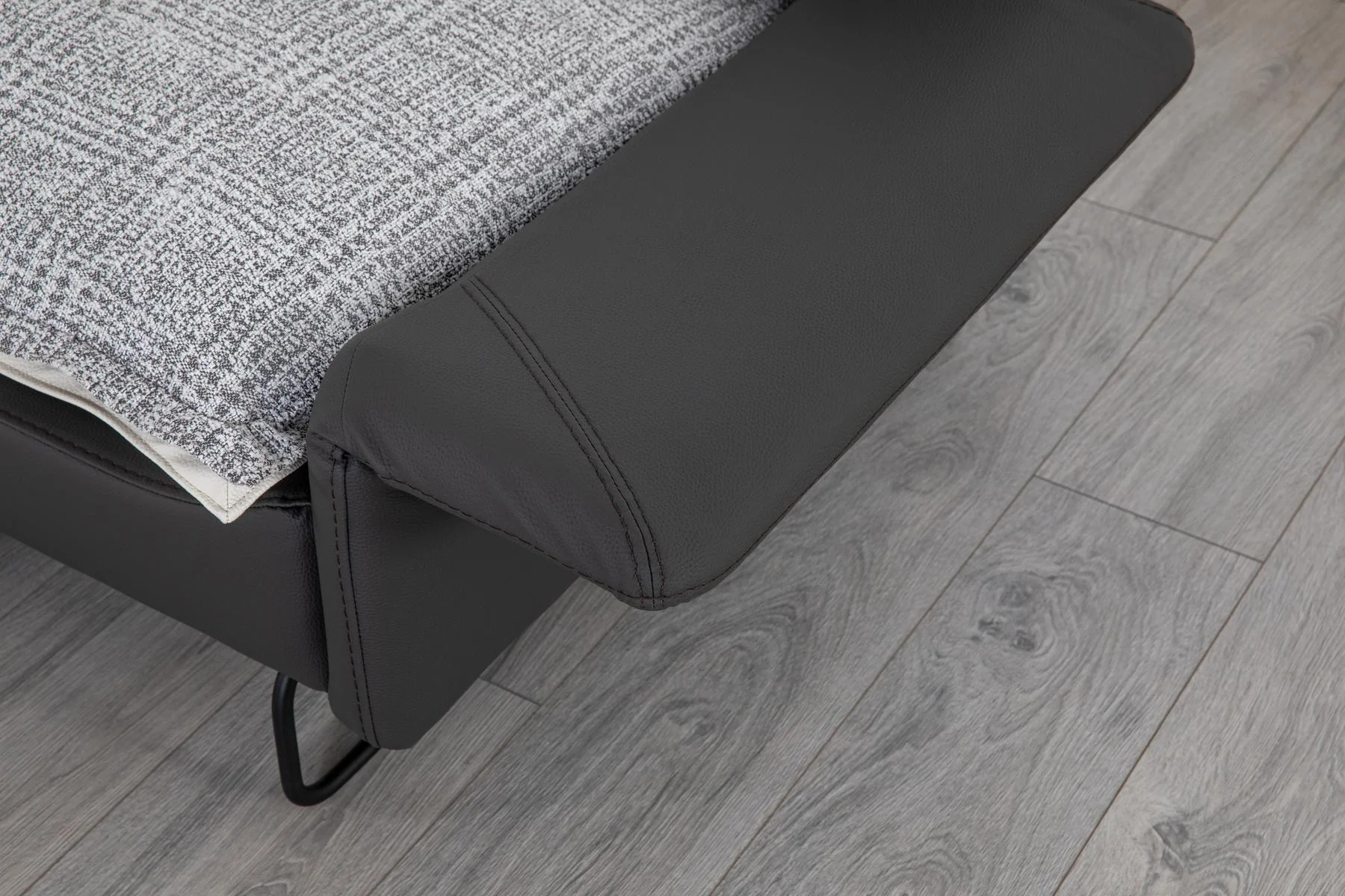AY IŞIĞI dark armchair lower frame and elevated leg design detail