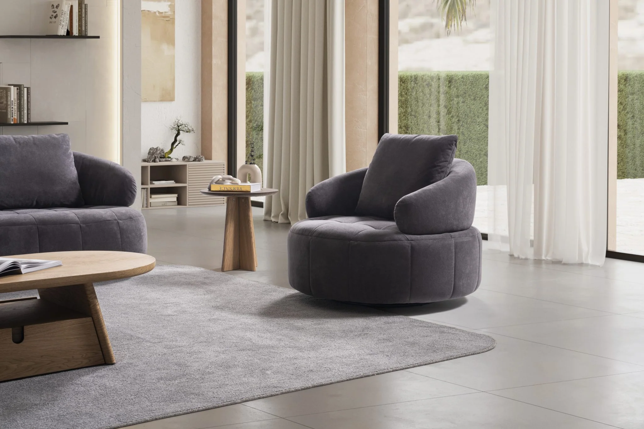 BOSTON rounded accent armchair with sculptural arms and quilted seat detail