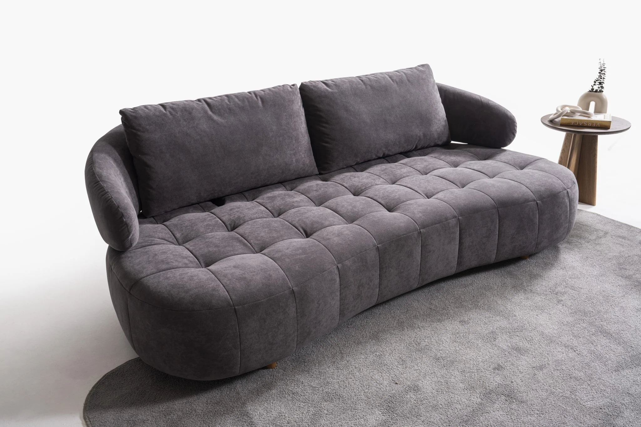 BOSTON modern three-seat sofa isolated view showing the rounded base and grid-stitched seating