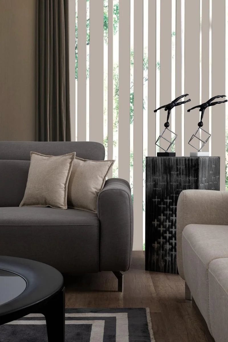 BURGAZ luxury accent chair beside a three-seat sofa in a neutral interior
