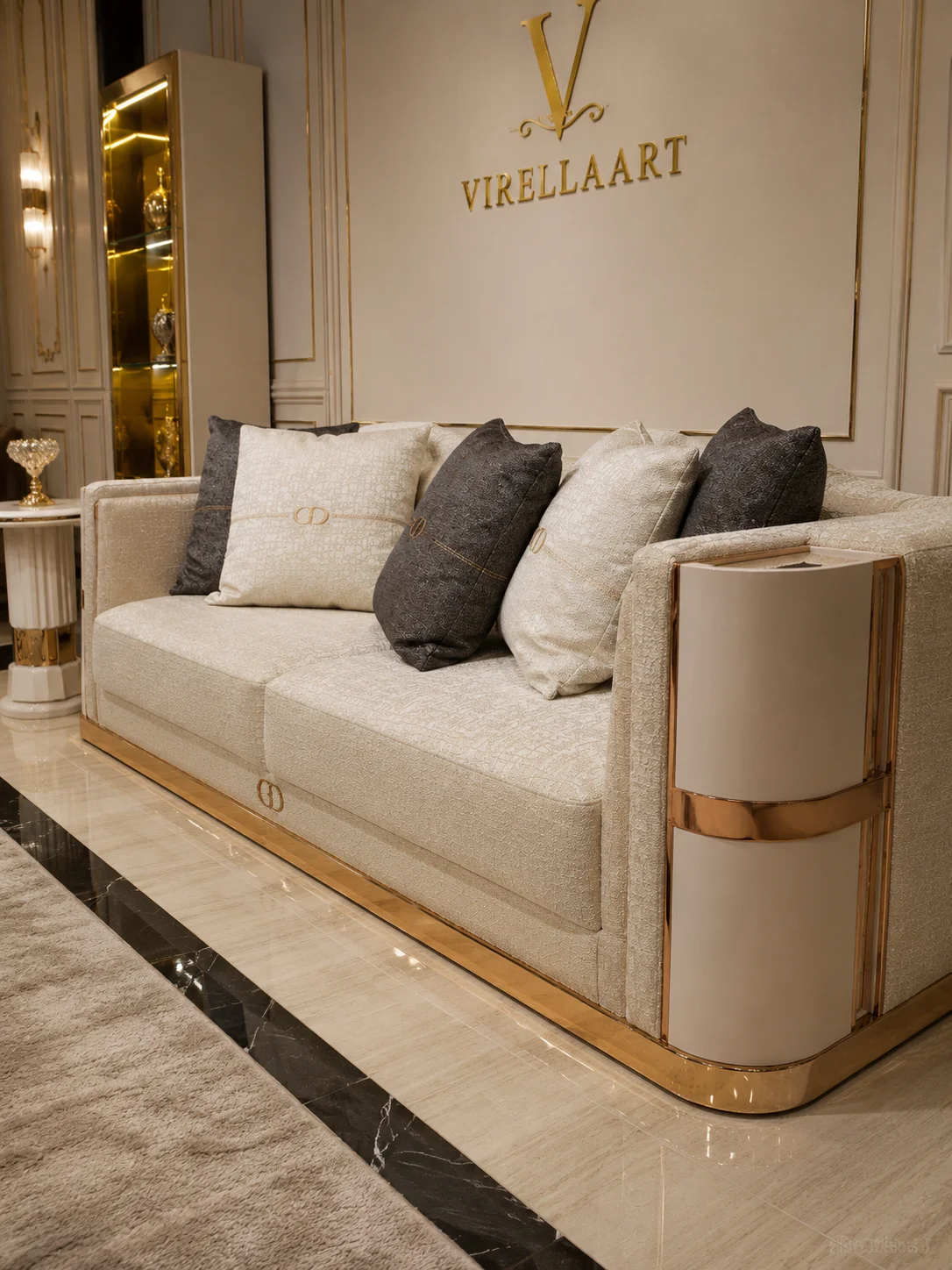 Deluxe ivory three-seat sofa with layered cushions, rounded side panels and a polished gold-tone base