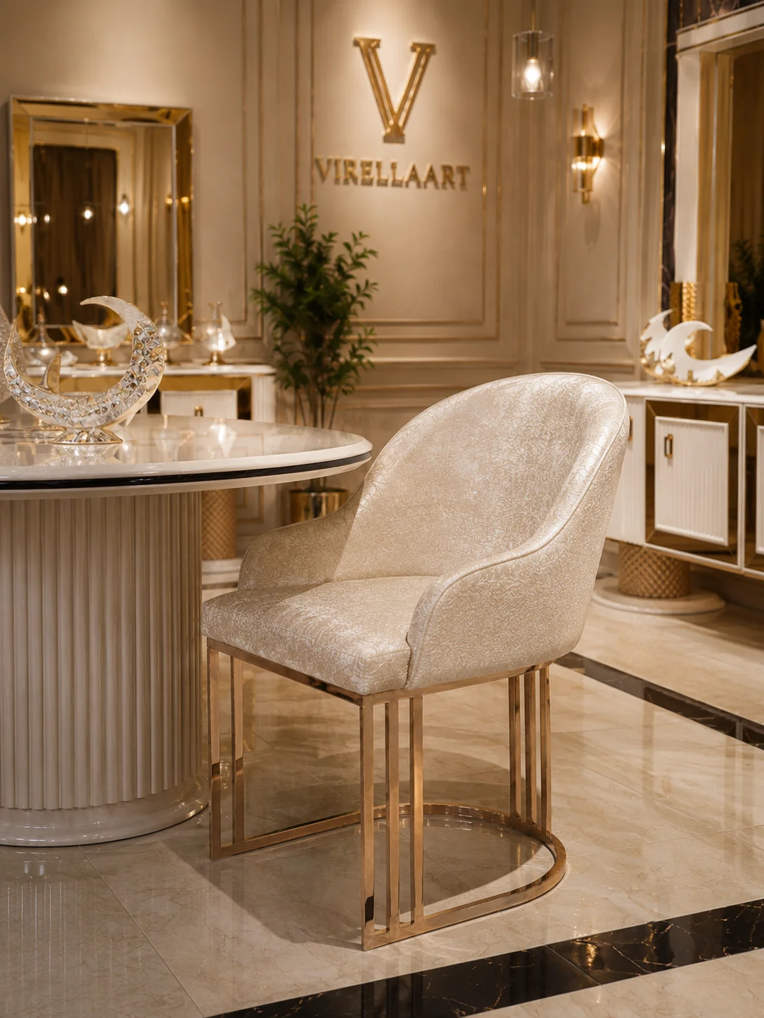 Deluxe ivory dining chair close-up with a rounded upholstered back, patterned fabric and polished gold-tone sled base
