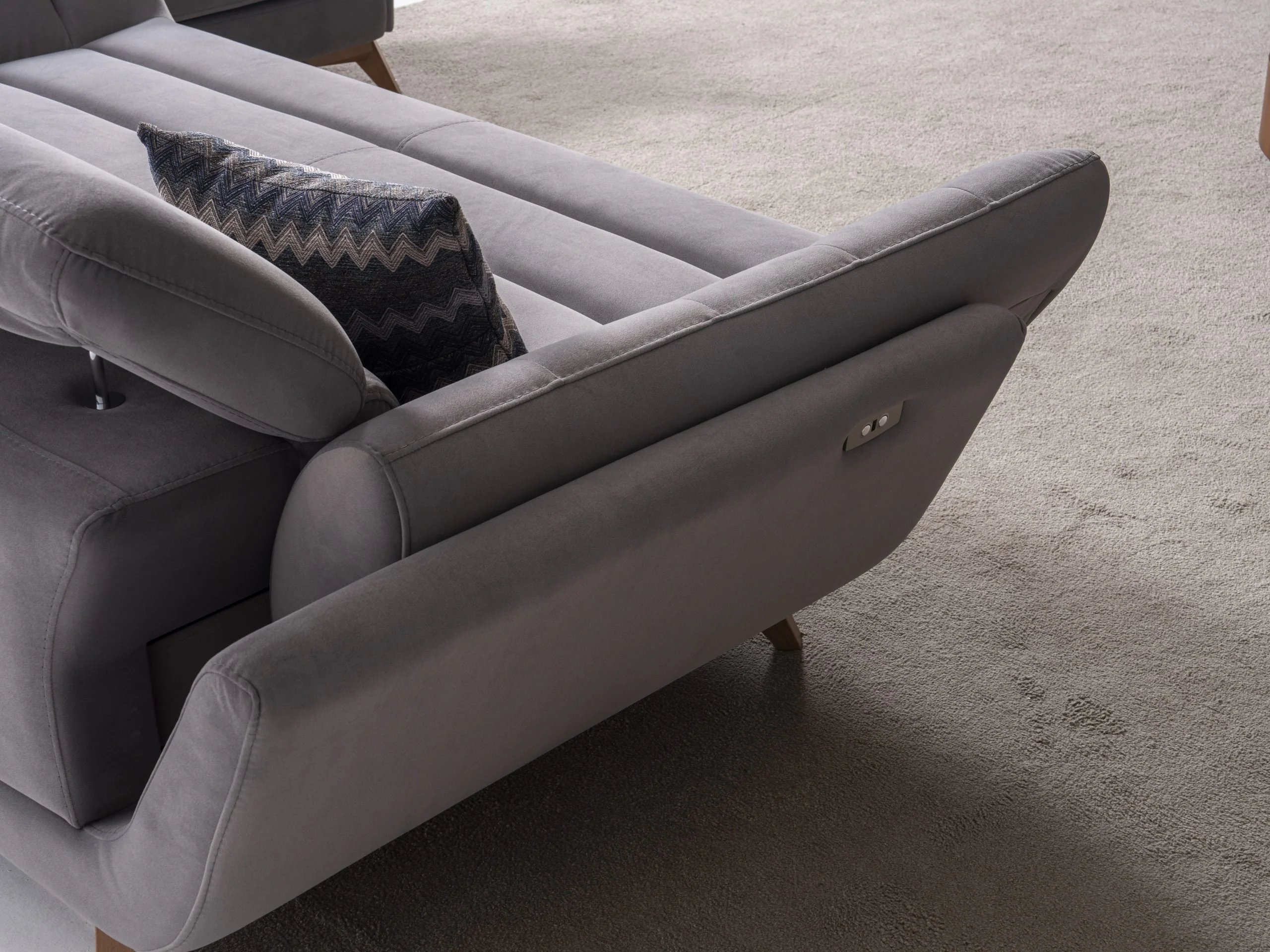 EFTELYA sofa rear and side detail highlighting its sculptural modern silhouette