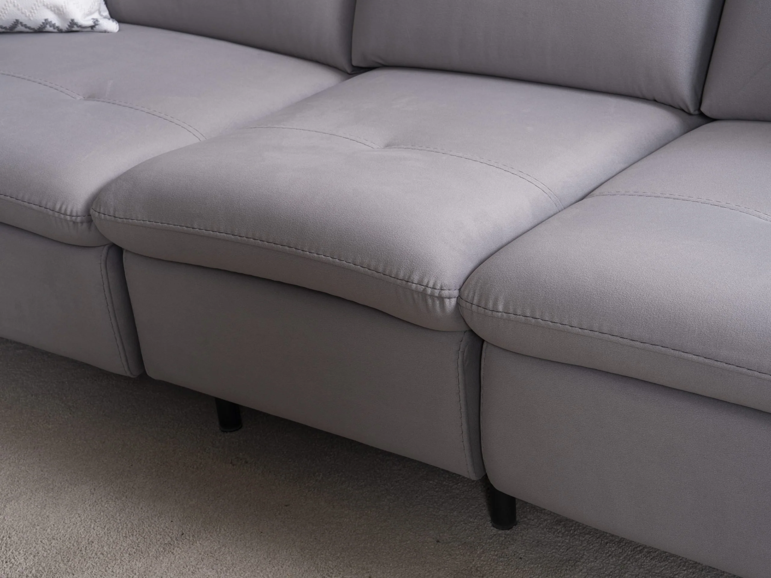 GIZEM reclining seat close-up showing the cushioned footrest and tailored upholstery