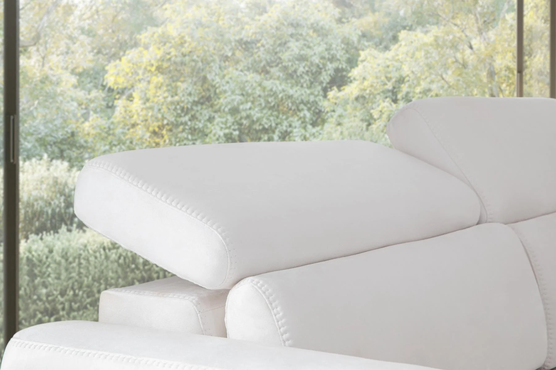 HÜNKAR sofa arm and warm wood frame detail with angled supporting leg