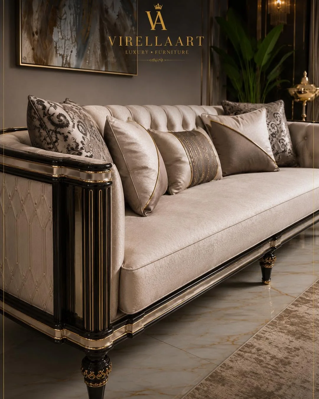 Close-up of the Lina ivory sofa with a tufted back, dark sculpted frame, gold-tone trim and patterned cushions