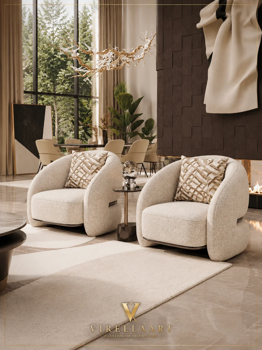 Pair of Queen ivory armchairs with rounded wraparound backs, patterned cushions and a slim side table
