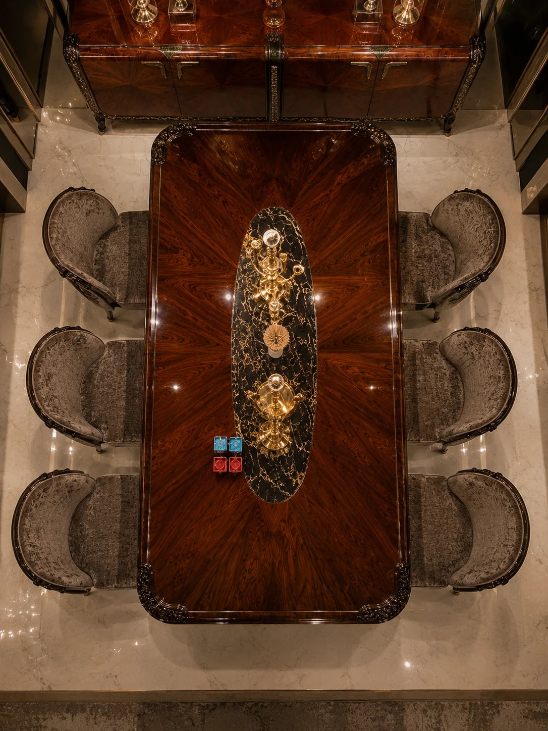 Riva dining table viewed from above with six upholstered dining chairs